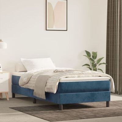 Cama individual azul em quarto minimalista com decoração neutra