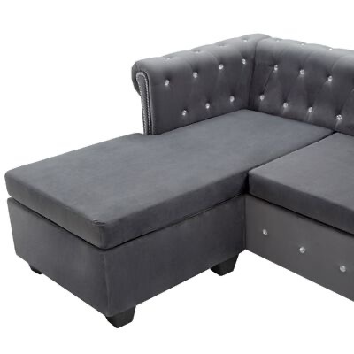 sofa-cama cinzento escuro com botões brilhantes e tachas prateadas, chaise-longue
