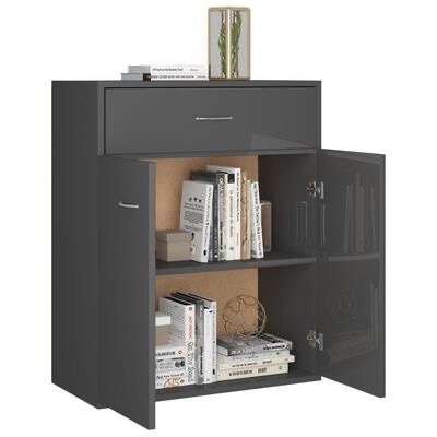 Móvel preto com gaveta e portas abertas mostrando livros e caixa, com objetos decorativos em cima