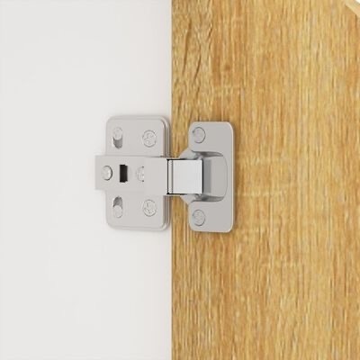 Dobradiça metálica prateada numa porta de madeira clara e superfície branca