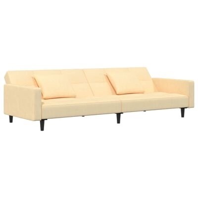 Sofá de tecido bege claro com almofadas e pés de madeira escura