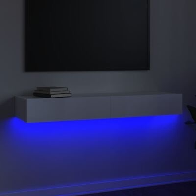 Móvel branco flutuante com iluminação LED azul e livros em cima