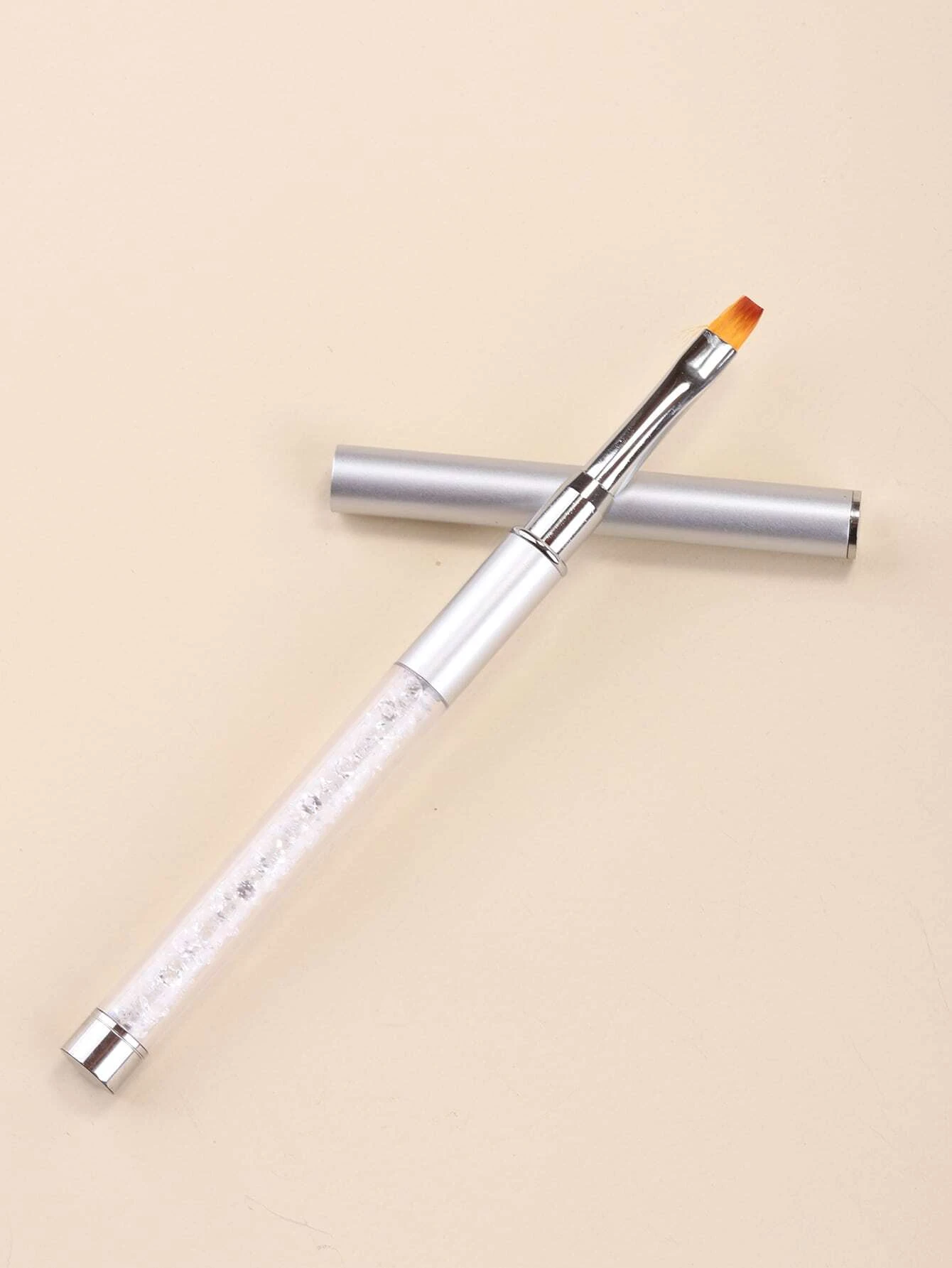 Pincel de unhas com cabo transparente e tampa prateada