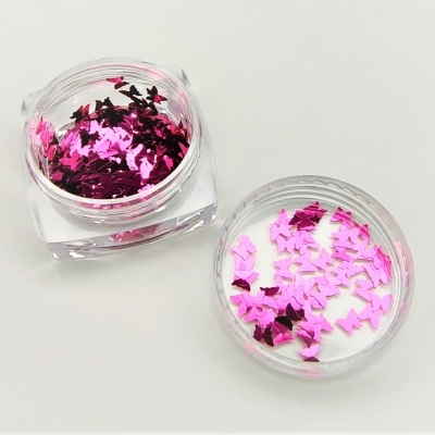 Frascos transparentes com purpurina rosa metálica em forma de borboletas