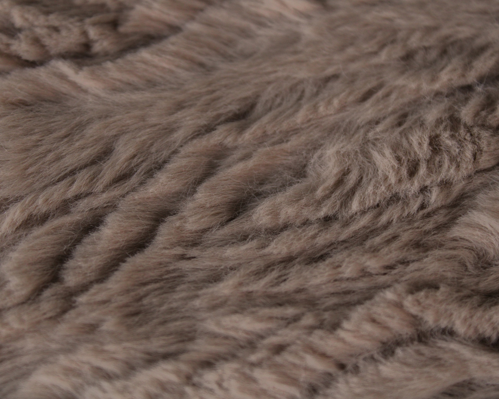 Tecido felpudo bege claro com padrão ondulado