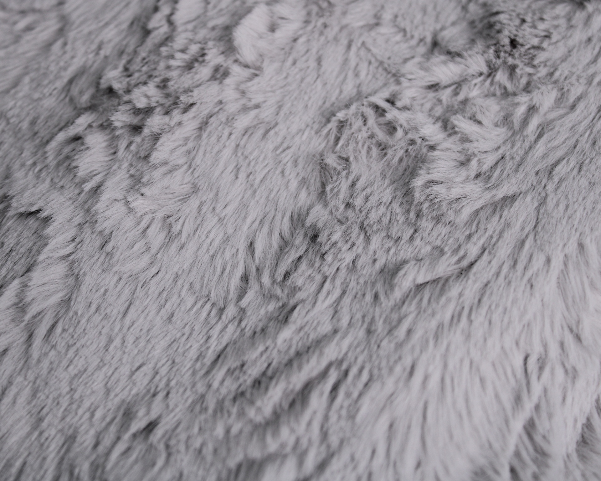 Textura cinzenta de pêlo felpudo e macio