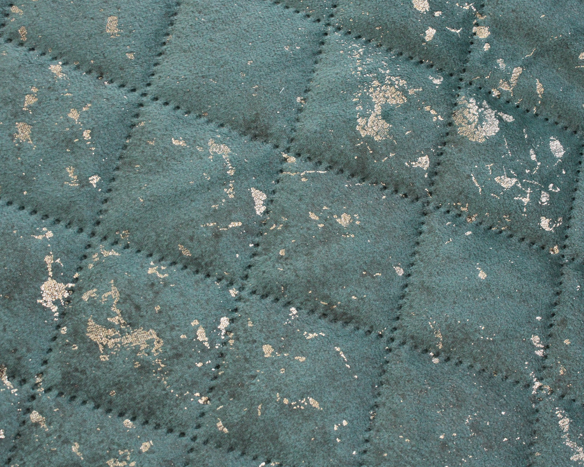 Tecido verde acolchoado com manchas douradas