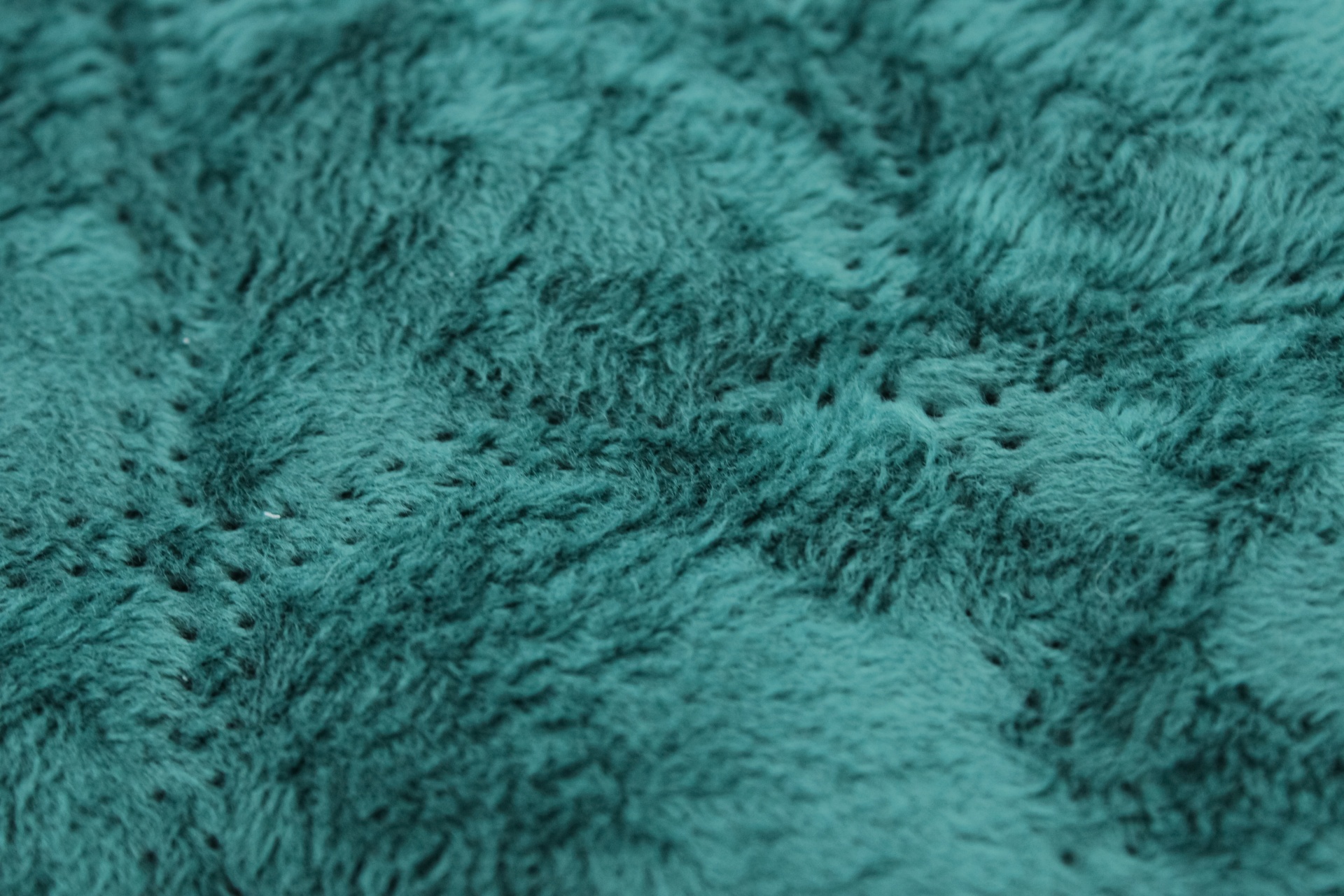 tecido felpudo verde-azulado com textura macia