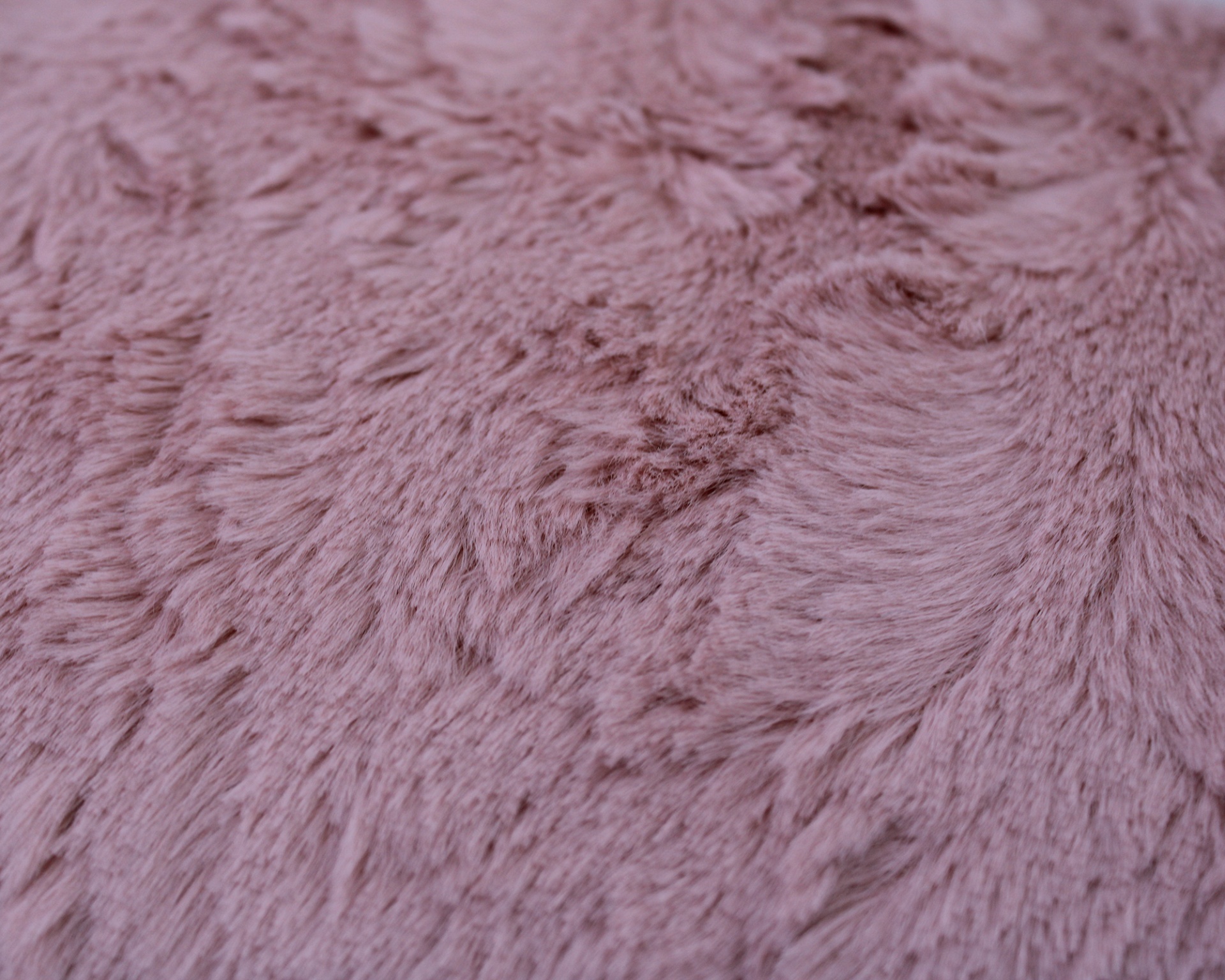 Superfície cor-de-rosa macia e peluda com textura uniforme