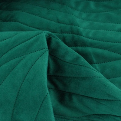 tecido acolchoado verde com padrão triangular