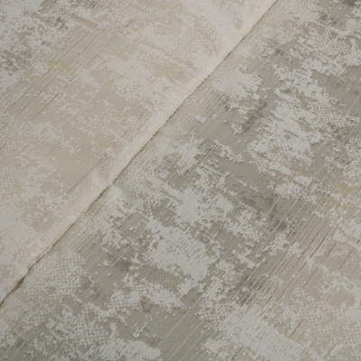 Tecido bege e cinza claro com padrão abstrato e textura brilhante