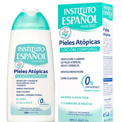 Frasco branco com tampa azul turquesa e embalagem azul com texto do Instituto Español Pieles Atópicas