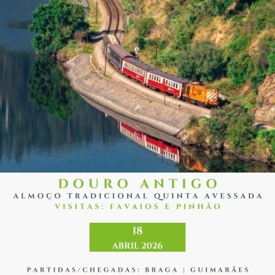 Comboio antigo vermelho e creme junto a rio com vegetação, promoção Douro Antigo 18 Abril 2026