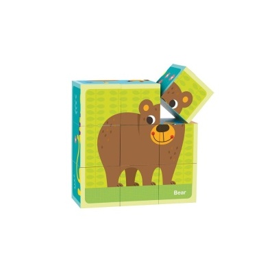 Blocos de madeira para montar a figura de um urso castanho em fundo verde