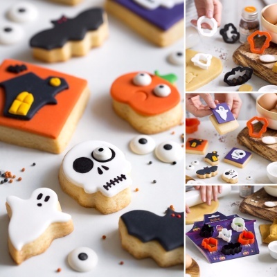 Bolachas decoradas de Halloween com moldes para cortar massa em fundo claro