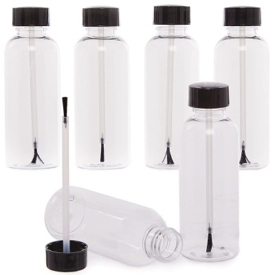 Garrafas de tinta e cola com pincel