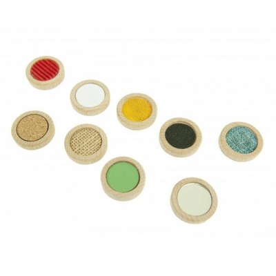 Diversos discos redondos de madeira com texturas e cores variadas