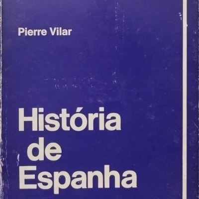 Capa de livro azul com texto branco 'História de Espanha' de Pierre Vilar da Colecção Horizonte número 9 