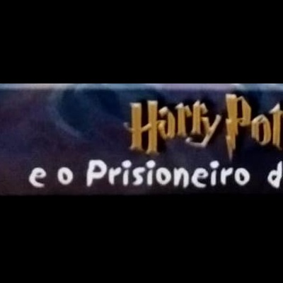 Lombada de livro preto com texto 'J. K. Rowling', 'Harry Potter e o Prisioneiro de Azkaban', número 13 e ícone dourado