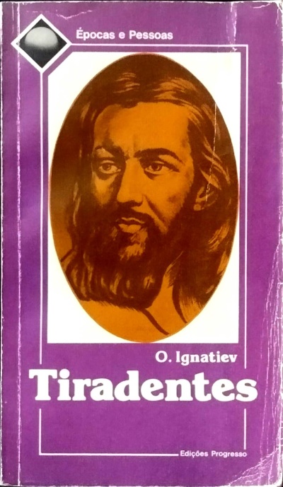 Capa de livro roxa com retrato oval de homem barbado e texto Tiradentes O. Ignatiev
