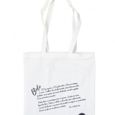 Saco de lona branco com texto manuscrito e selo preto