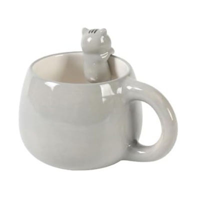 Caneca branca de cerâmica com figura de gato no interior