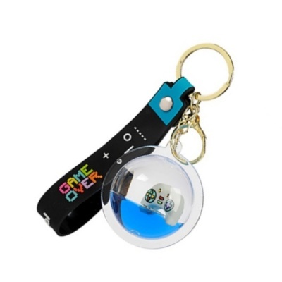 Porta-chaves com pulseira preta 'GAME OVER' e bola transparente com mini comando