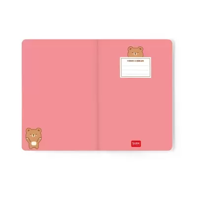 Caderno rosa aberto com ilustrações de ursos e etiqueta com texto I HAVE A DREAM.