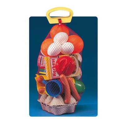 Saco amarelo com ovos e brinquedos coloridos