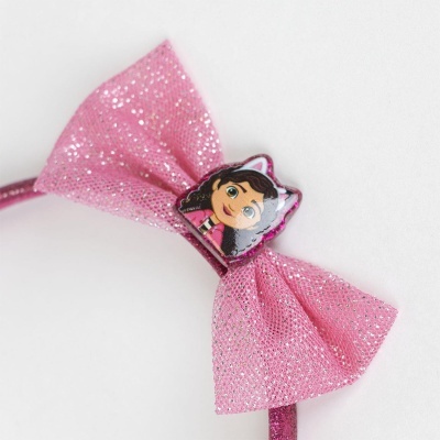 Arco de cabelo cor-de-rosa com fita brilhante e figura de personagem de desenho animado