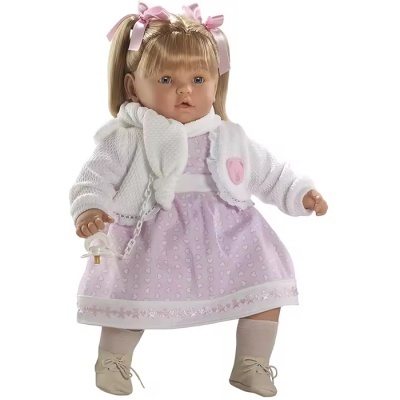 Boneca com vestido lilás e casaco branco, segurando chupeta.