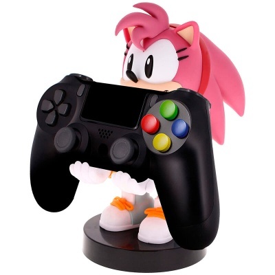 Suporte para comando de videojogos com personagem rosa a segurar um comando preto colorido