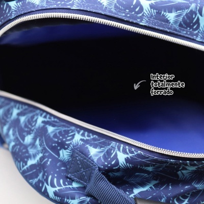 Mala azul com padrão de folhas e interior azul liso aberto