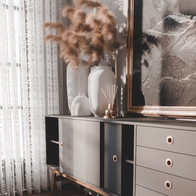 Móvel cinzento de madeira com vasos e difusor em ambiente iluminado