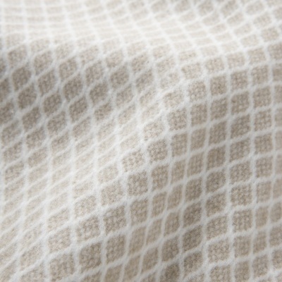 Tecido bege e branco com padrão de losangos e textura suave