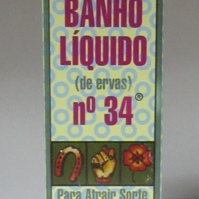 Embalagem retangular azul e amarelo claro com texto e imagens para banho líquido n.º 34 de ervas