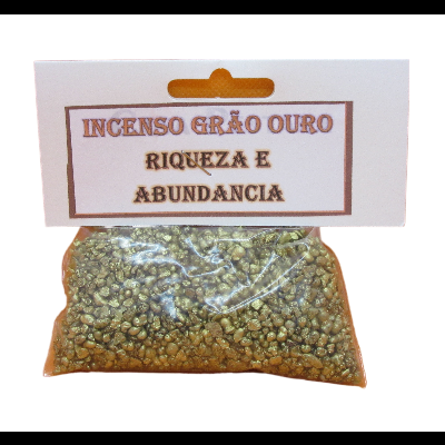 Pacote de incenso grão dourado com etiqueta escrita 'INCENSO GRÃO OURO RIQUEZA E ABUNDÂNCIA'