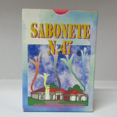 Caixa colorida de sabonete SABONETE N.47 com imagem de casa e texto para pele seca e completa