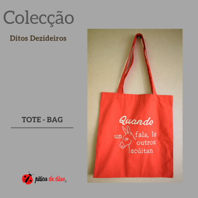 Sacola tote de tecido laranja com alças e texto branco com desenho de burro