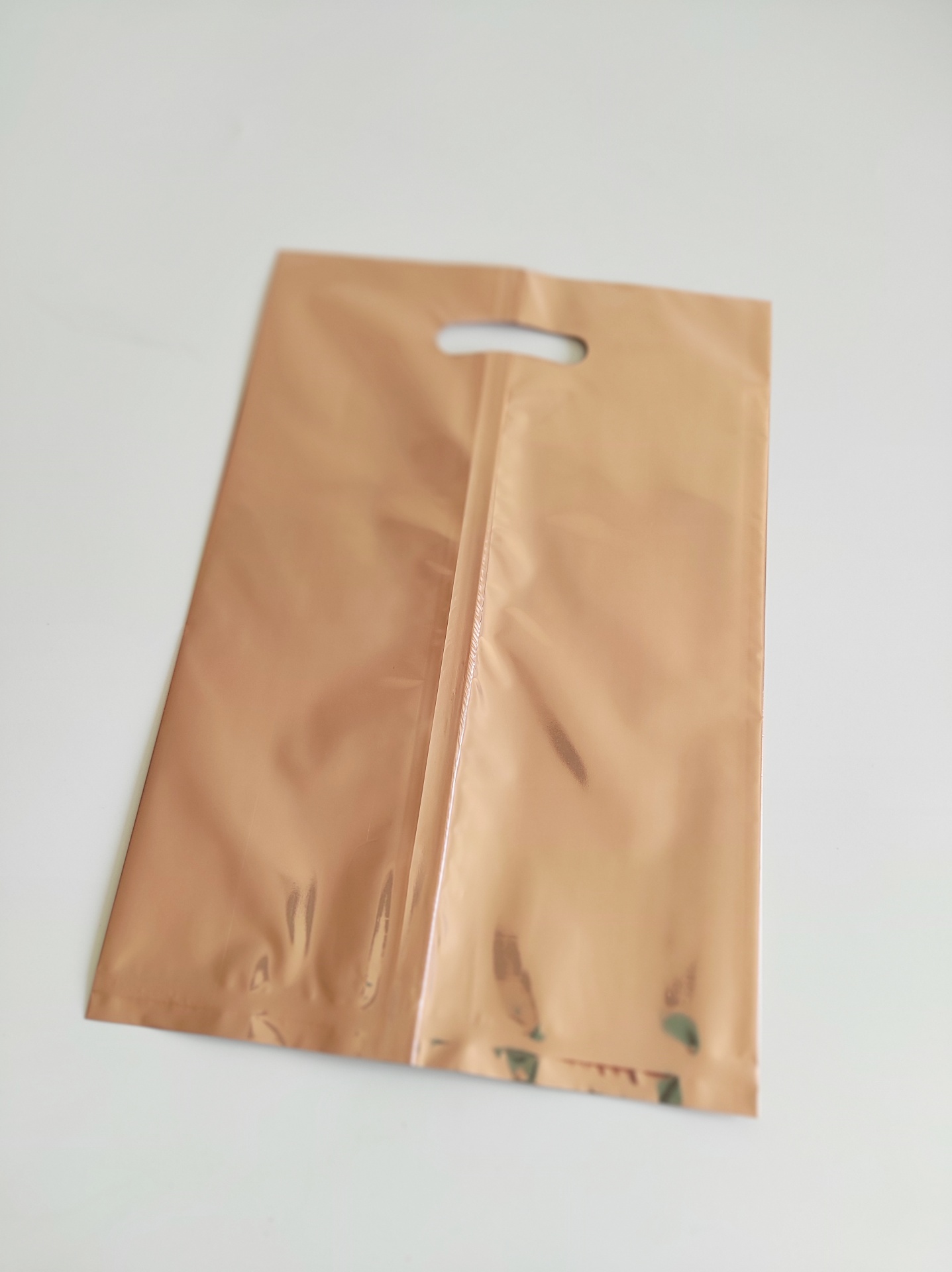 Sacos metalizados rose gold