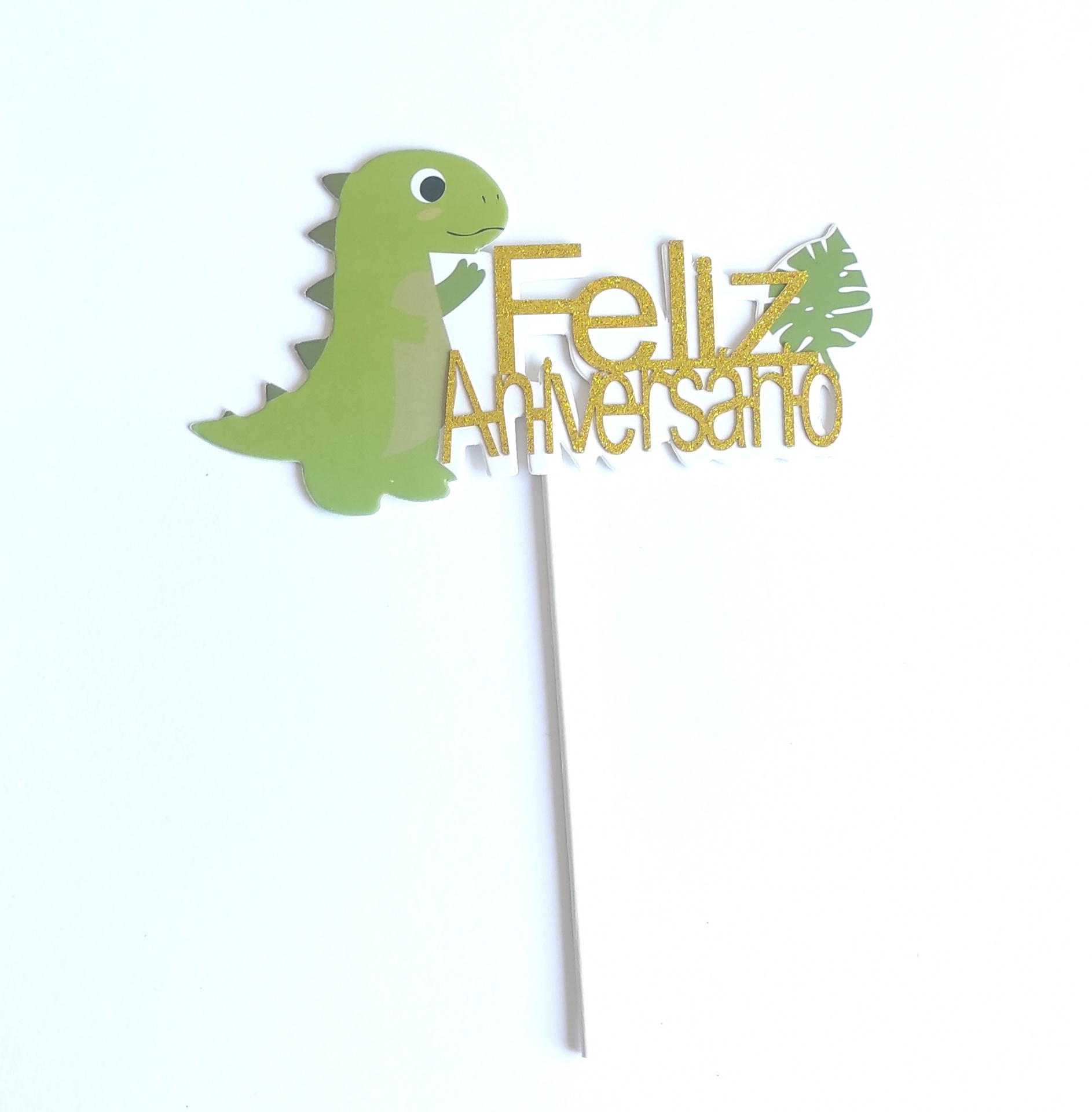 Topo de bolo com dinossauro e texto 'Feliz Aniversário'