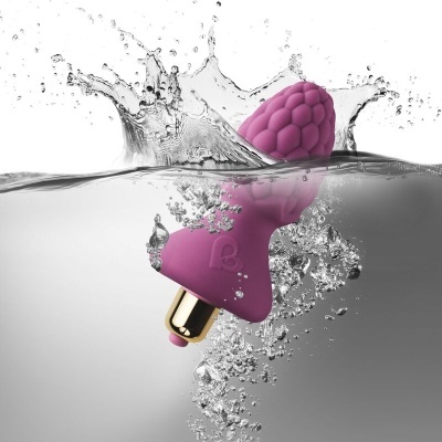 Vibrador roxo texturizado com base dourada em água