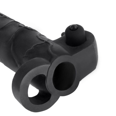 Acessório preto de silicone com texturas e duas aberturas circulares