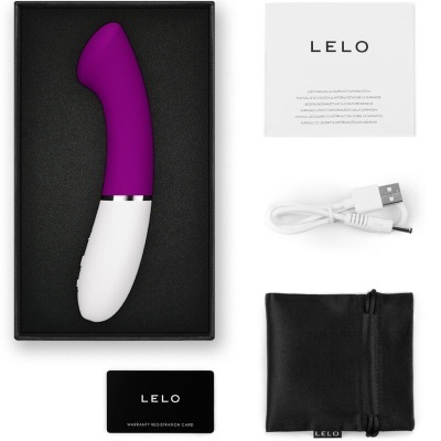 Vibrador roxo e branco com acessórios e manual da marca LELO