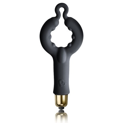 Produto preto de silicone com base dourada, fundo branco