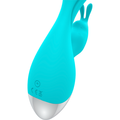 vibrador turquesa em silicone com base prateada