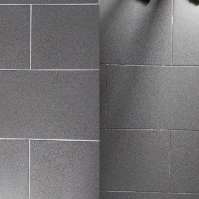 Piso cerâmico cinza escuro com padrão retangular e juntas claras