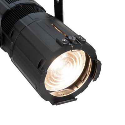 Foco de teatro preto com lente circular iluminada