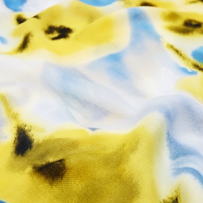 tecido com padrão floral amarelo, azul e preto