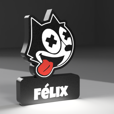 Figura decorativa de gato com olhos em cruz e base com texto FÉLIX